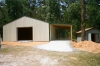 30x40x10, 12' lean-to. light stone walls fern green roof and trim.
