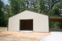 30x40x10, 12' lean-to. light stone walls fern green roof and trim.